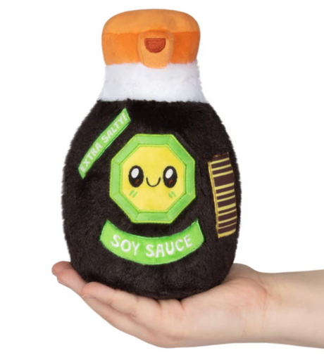 Plush soy sauce bottle with cute smiling label held in hand, soft and perfect for all ages zero and up