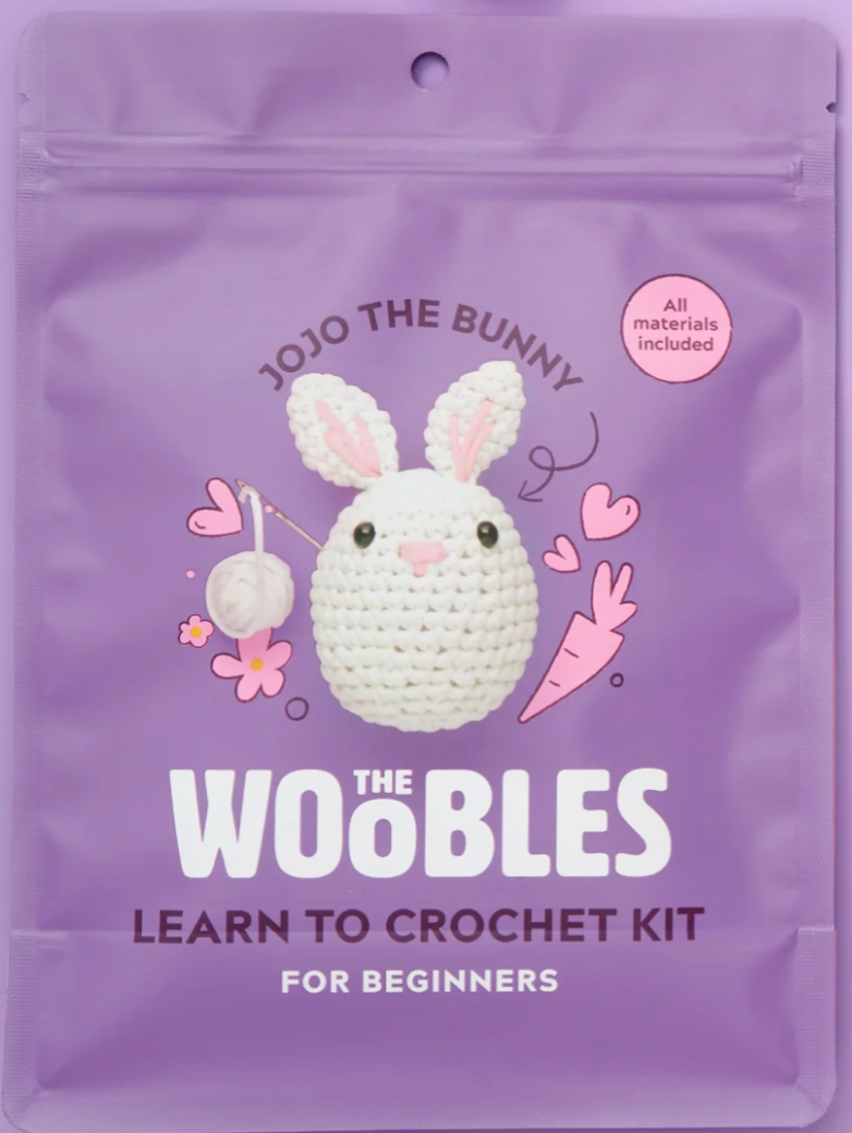 Purple pouch packaging of a beginner crochet kit featuring Jojo the Bunny with all materials included for easy crafting.