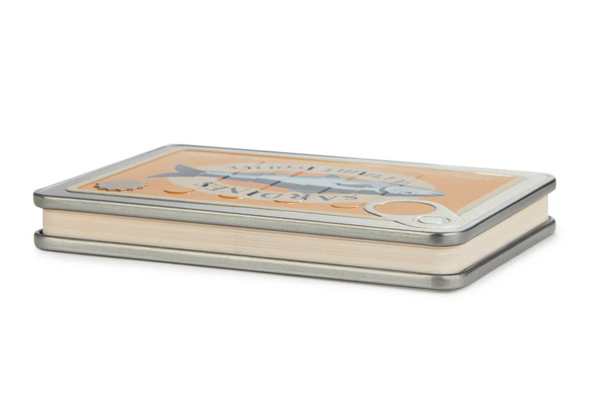 Compact notebook designed to look like a vintage sardine tin with metal cover and rounded edges