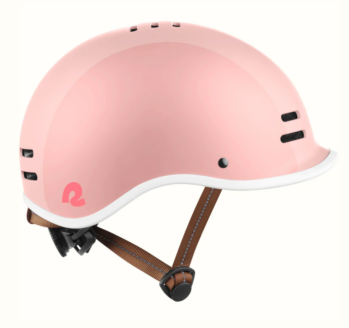 Remi Kids Bike & Skate Helmet in pink with built-in visor, adjustable straps, and breathable ventilation for safety and comfort.