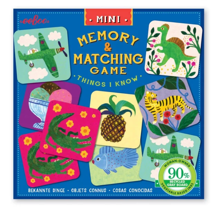 Mini Memory & Matching Game featuring whimsical illustrated cards including animals, pineapple, dinosaur, and airplane designs.