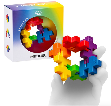 HEXEL colorful fidget toy held in hand with packaging box displaying connected Plus-Plus pieces in a hexagonal shape.