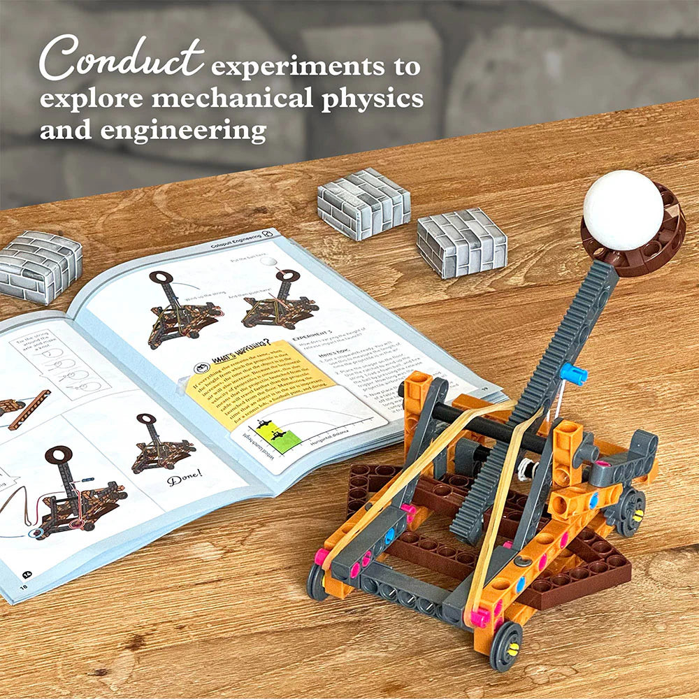 Catapult Engineering model showing a medieval launcher with foam ball and instruction manual for physics experiments.