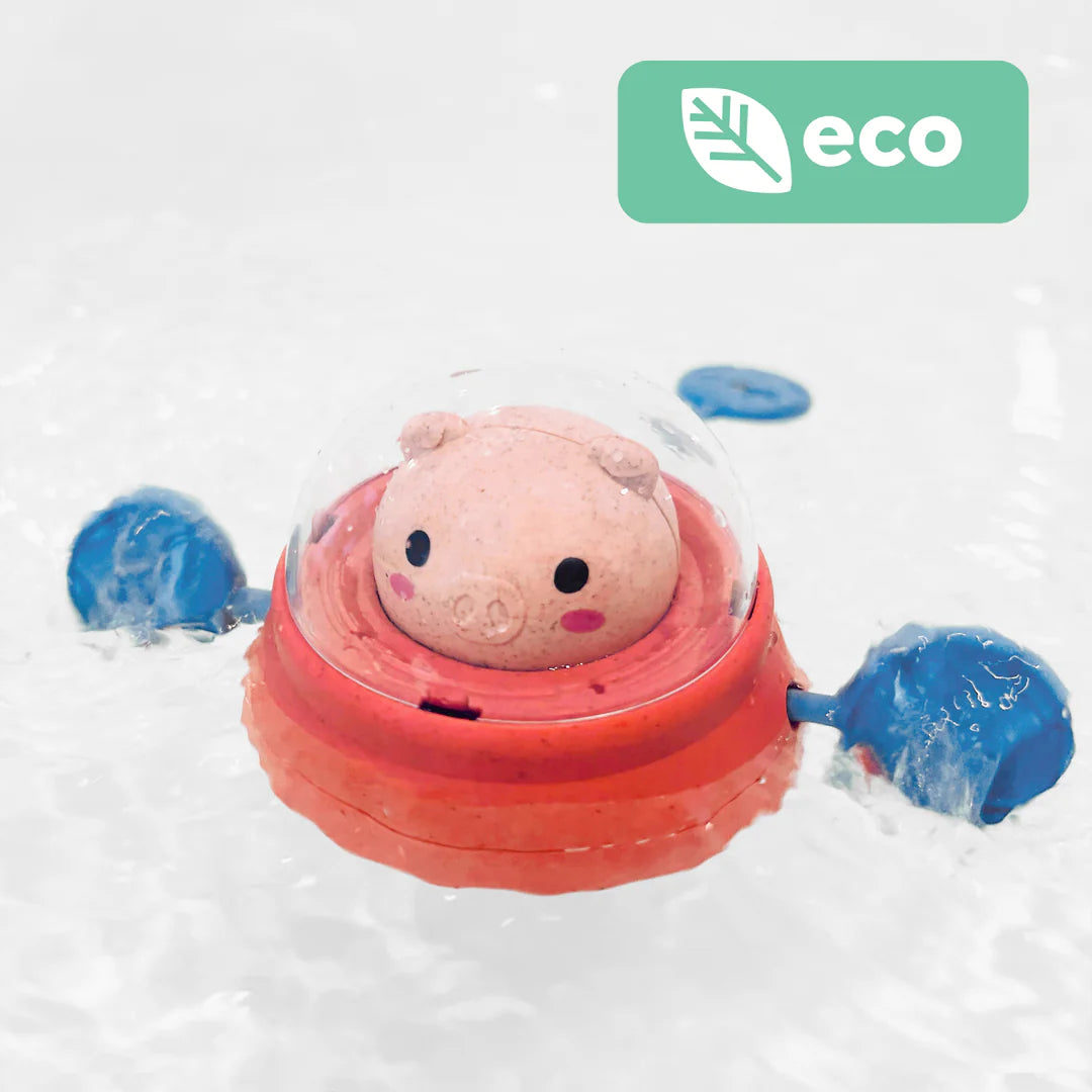 Bath Paddle Ship Space Piggy bath toy floating with blue paddles, eco-friendly and designed for water play.