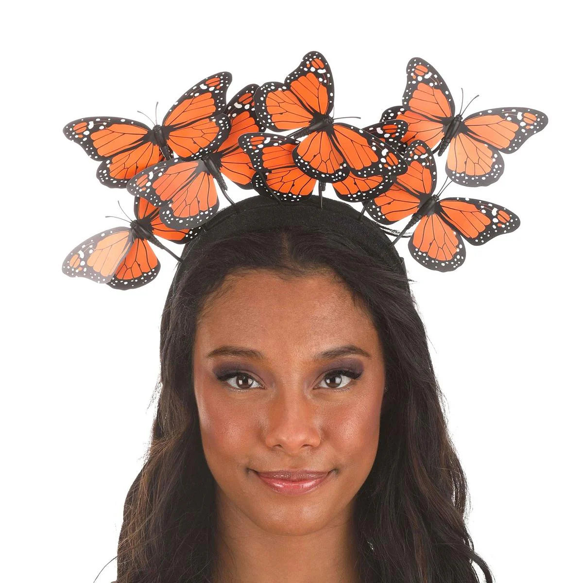 Woman wearing Deluxe Butterfly Headband with orange plastic butterflies on adjustable wires and velvet band.