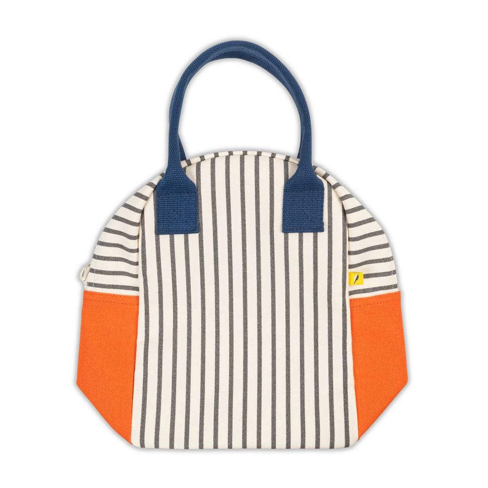 Striped organic cotton lunch bag with navy handles and bright orange side pockets, zipper closure, and interior pocket.