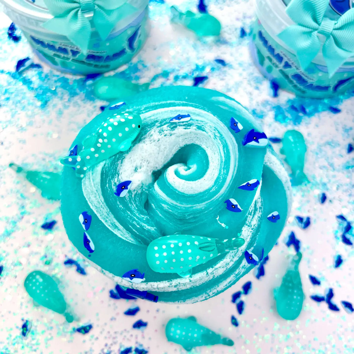 Gummy Shark Jelly Creme Slime with swirls, shark fimo slices, and whale shark charms in a vibrant ocean theme.