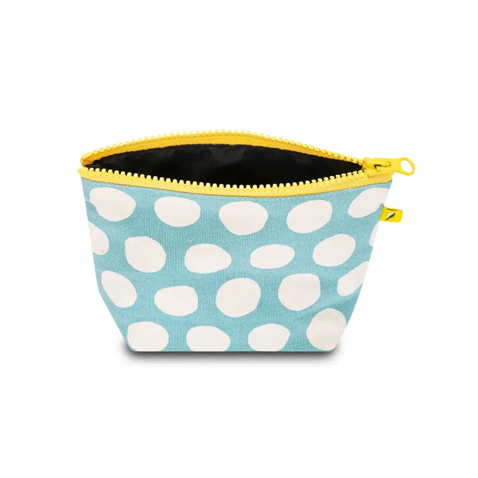 Small blue pouch with large white dots and bright yellow zipper, made of organic cotton and recycled lining.