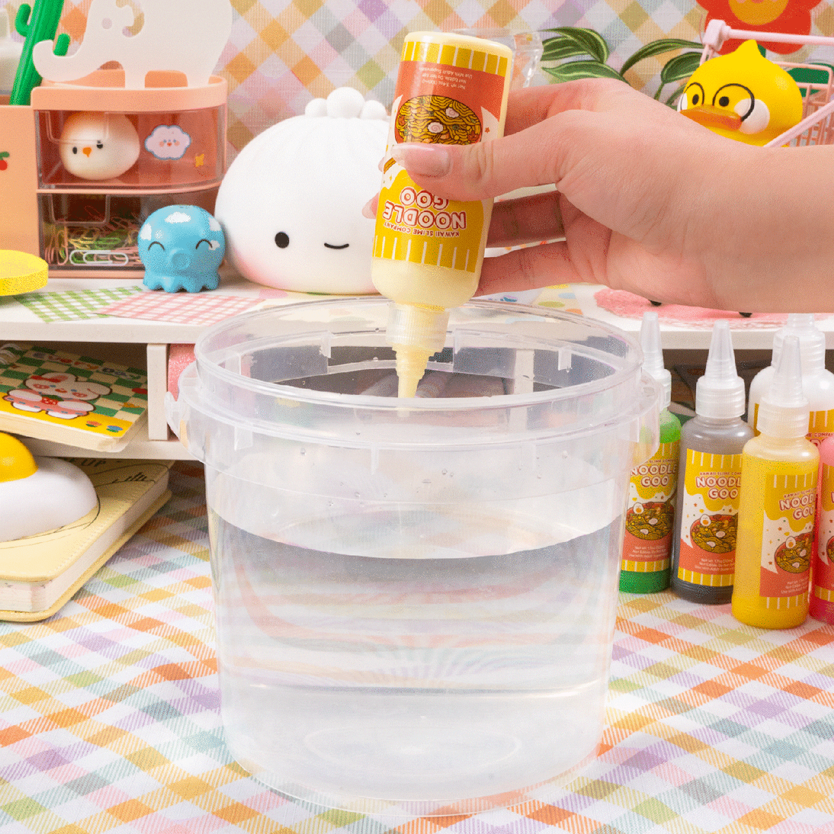 Instant Ramen Noodles Slime Kit showing liquid being poured into a clear container for slime creation.