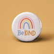 Button | Be Kind Rainbow with pastel rainbow design encouraging kindness, 1.25-inch expressive accessory for self-expression.