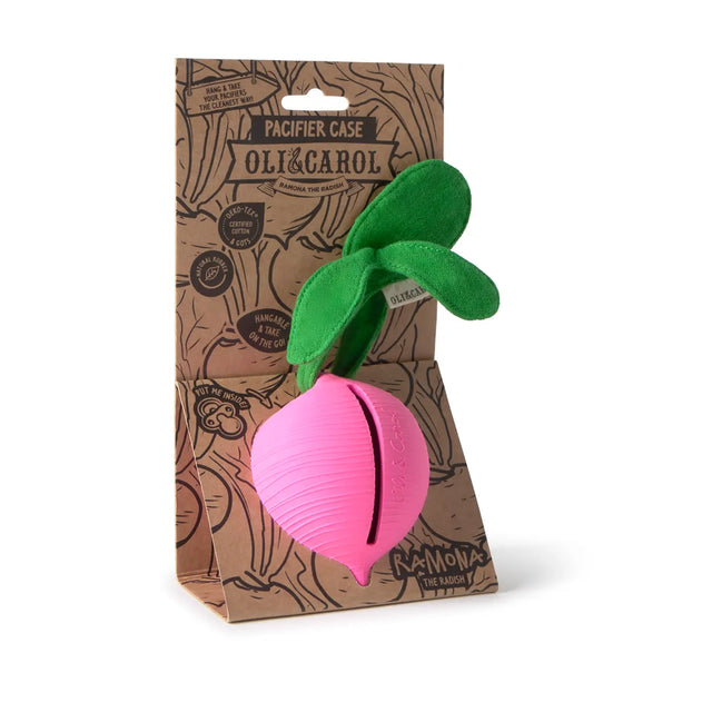 Pink radish-shaped pacifier case with green leaves made from natural rubber and organic cotton in eco-friendly packaging