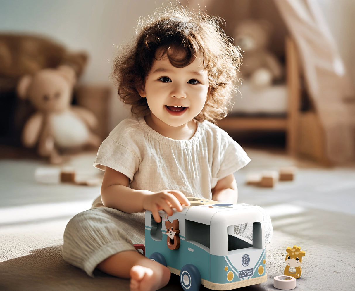 Toddler playing happily with a colorful wooden van shape sorter toy in a cozy room setting