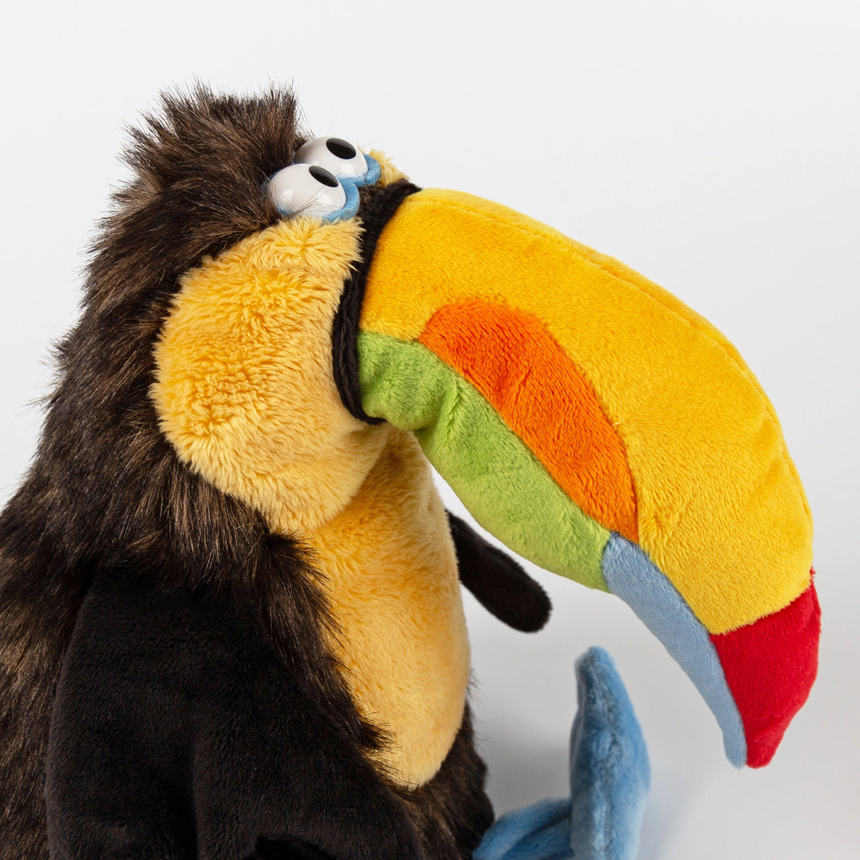 Chakka Tukan Toucan plush with large colorful beak and soft sky blue feet, perfect for children aged 3 and up.