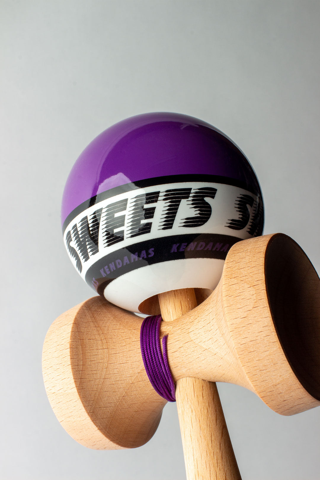Kendama Starter Purple with purple-topped tama, beech wood body, and clear tracking for beginner kendama players.