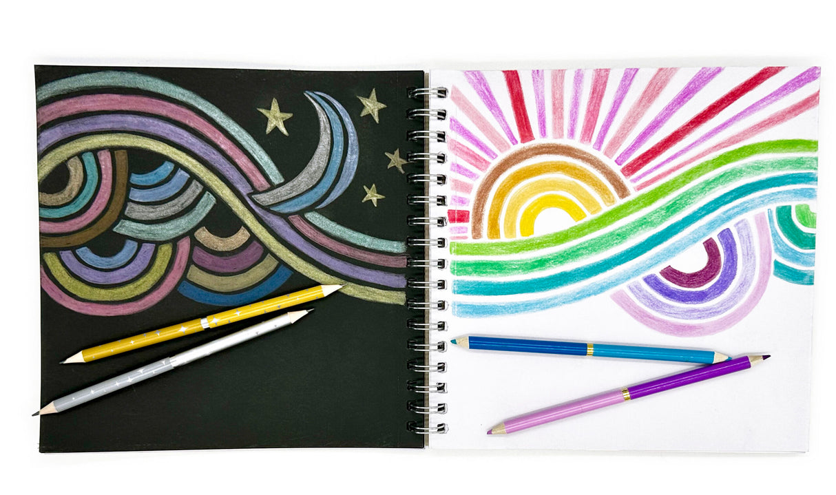 Black & White Paper Sketchbook open to colorful abstract drawings on black and white pages with colored pencils.