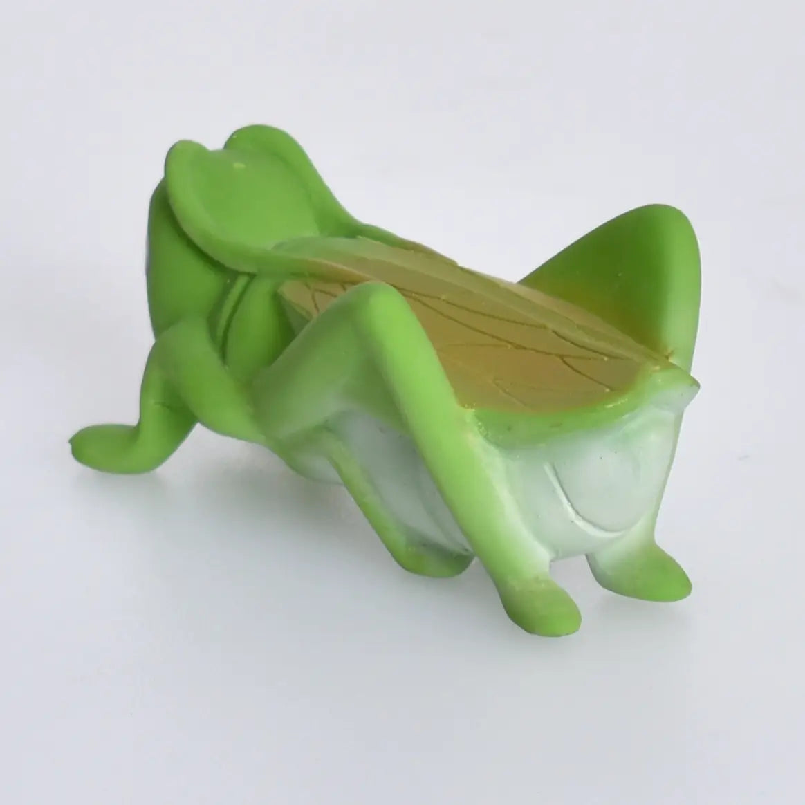 Organic Rubber Teether Rattle | Grasshopper in green natural rubber with enclosed rattle for soothing babies.