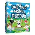 One Two Many Rabbits board game box with colorful cartoon rabbits on a bright blue sky and green grass background.