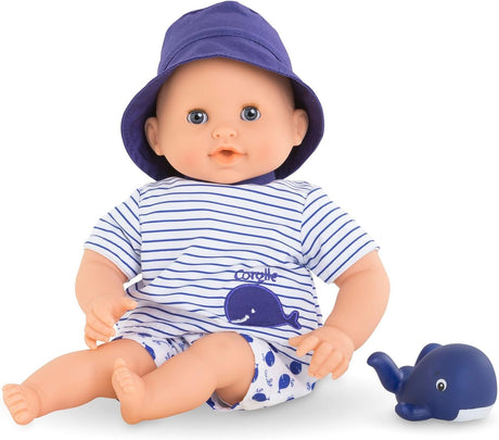 Bath Baby Marin doll wearing blue striped outfit and hat with a matching whale toy for water play.