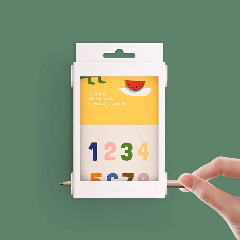 Scrollino 123 Learning Book packaging showing colorful numbers and a hand turning the scroll toy for counting wild animals.