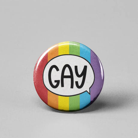 Button | Say Gay Rainbow featuring a colorful rainbow background with the word GAY in a speech bubble.
