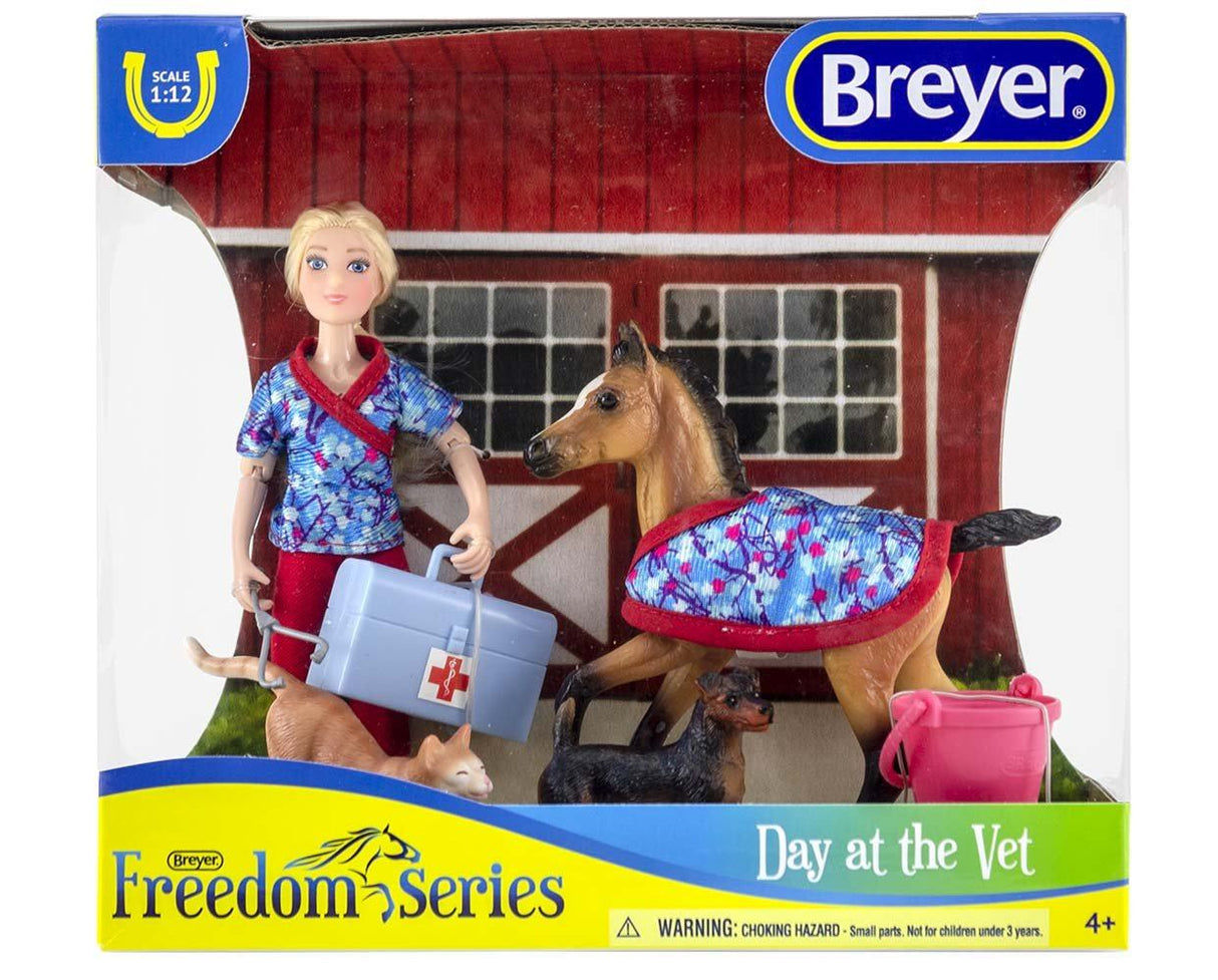 Breyer Day at the Vet set with articulated doll, foal, cat, dog, vet bag, bucket, and stethoscope in 1:12 scale.