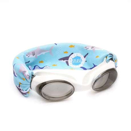 Googles Shark Attack swim goggles with shark print tangle-free strap, white frame, and lightly tinted grey lenses.