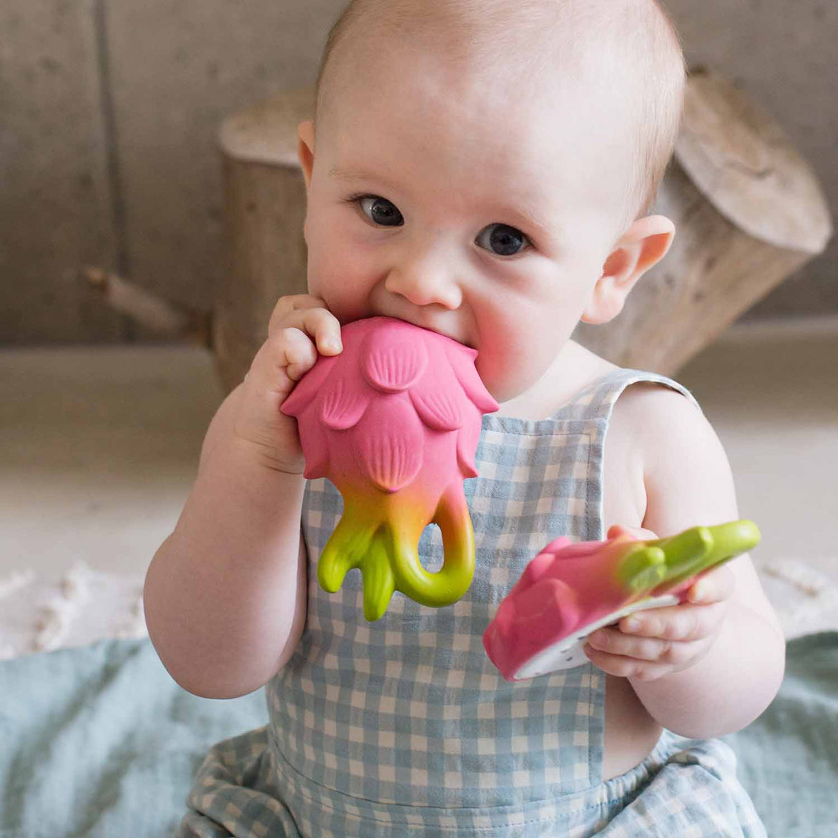 Baby chewing on Natural Teether | Fucsia the Dragonfruit made from 100% natural rubber, safe and colorful.