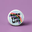 Button | Born This Way pinback button with rainbow and clouds design on a purple background, measuring 1.25 inches.