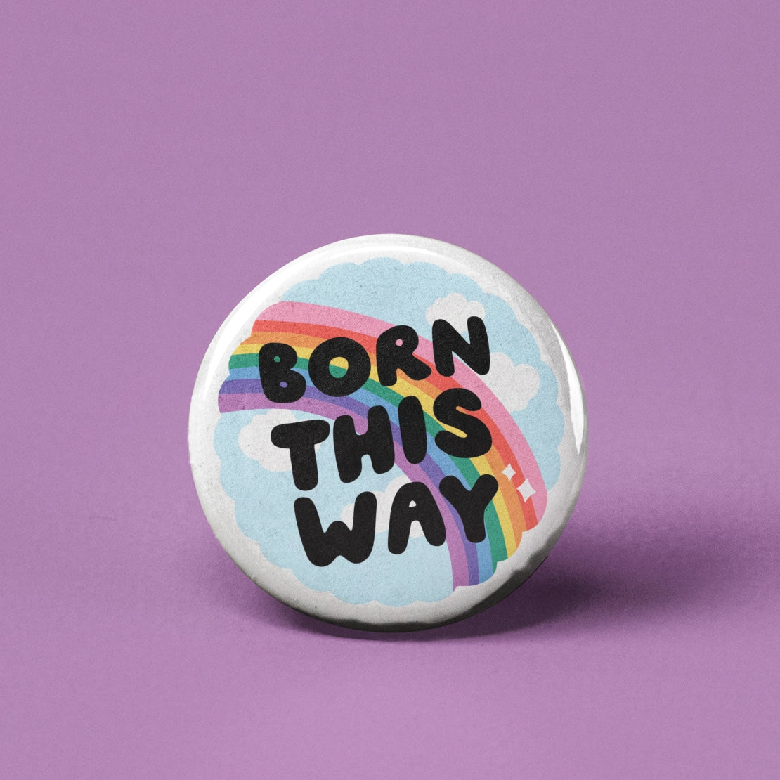 Button | Born This Way pinback button with rainbow and clouds design on a purple background, measuring 1.25 inches.