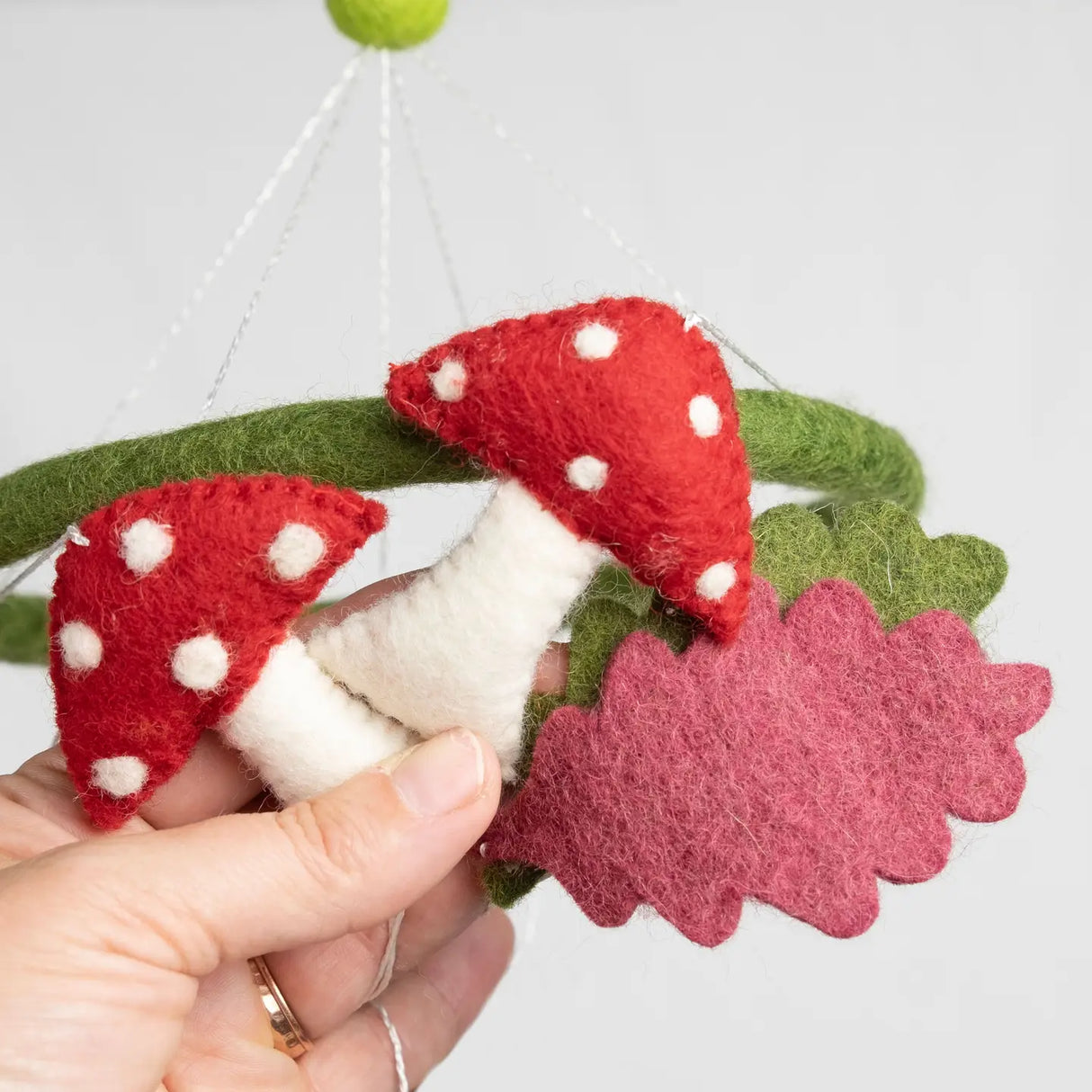 Felt Mobile | Forest Creatures showing handmade red and white spotted mushroom details in natural wool nursery decor.
