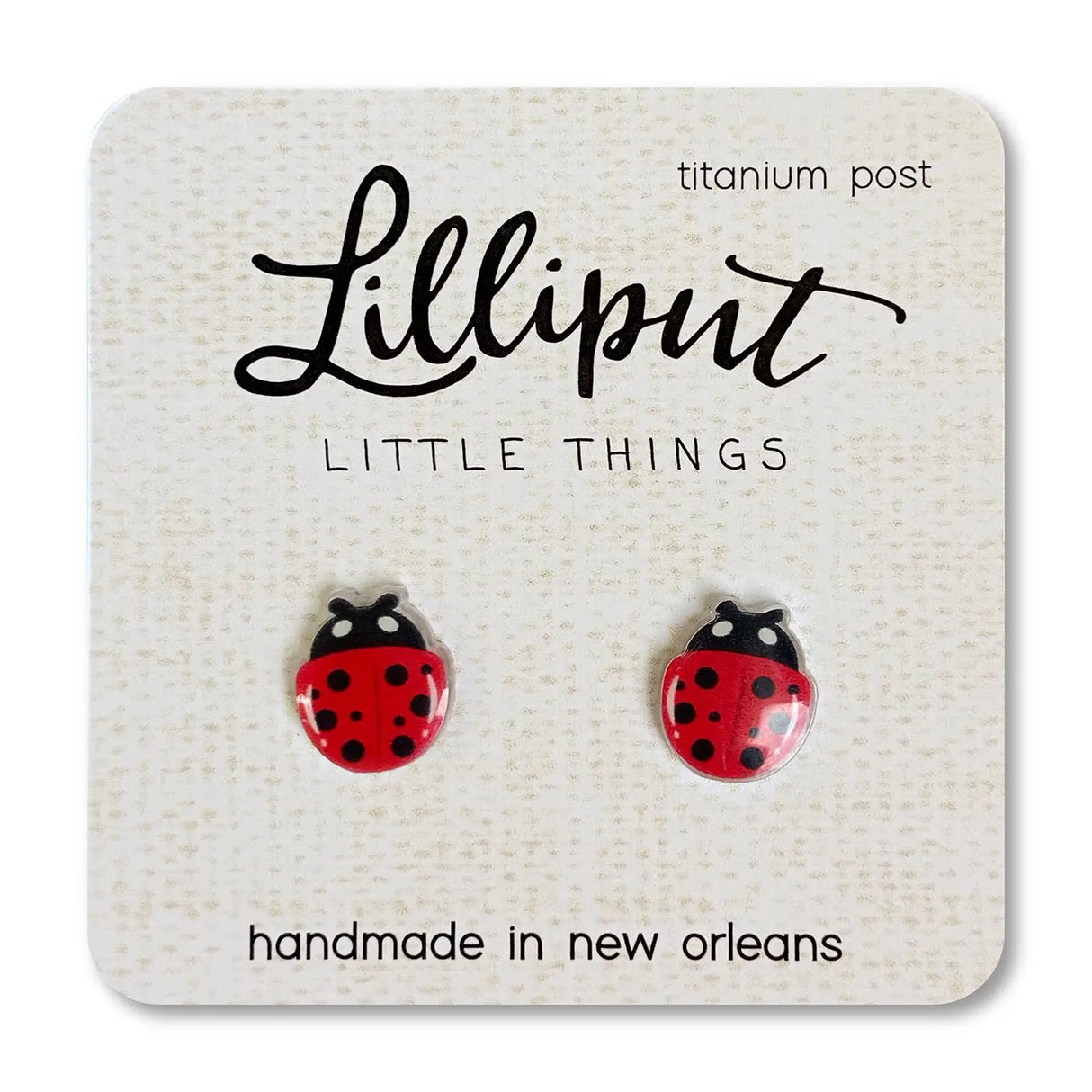 Ladybug Earrings with red and black design on titanium posts, handmade in New Orleans, lightweight and hypoallergenic.