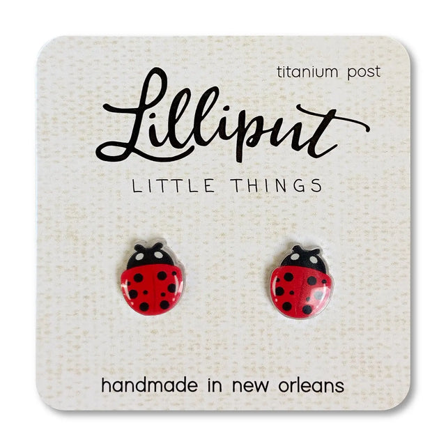 Ladybug Earrings with red and black design on titanium posts, handmade in New Orleans, lightweight and hypoallergenic.