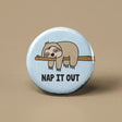 Button | Nap it Out Sloth featuring a sleeping sloth illustration with the words "NAP IT OUT" on a light blue background.
