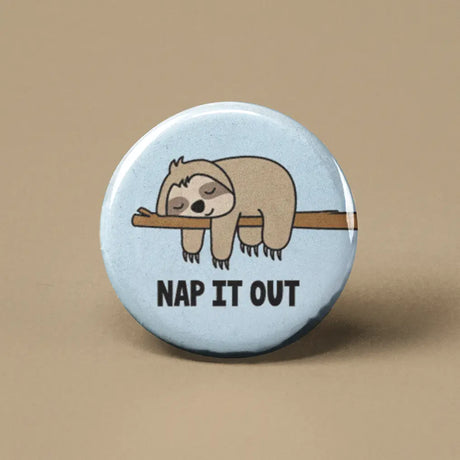 Button | Nap it Out Sloth featuring a sleeping sloth illustration with the words "NAP IT OUT" on a light blue background.