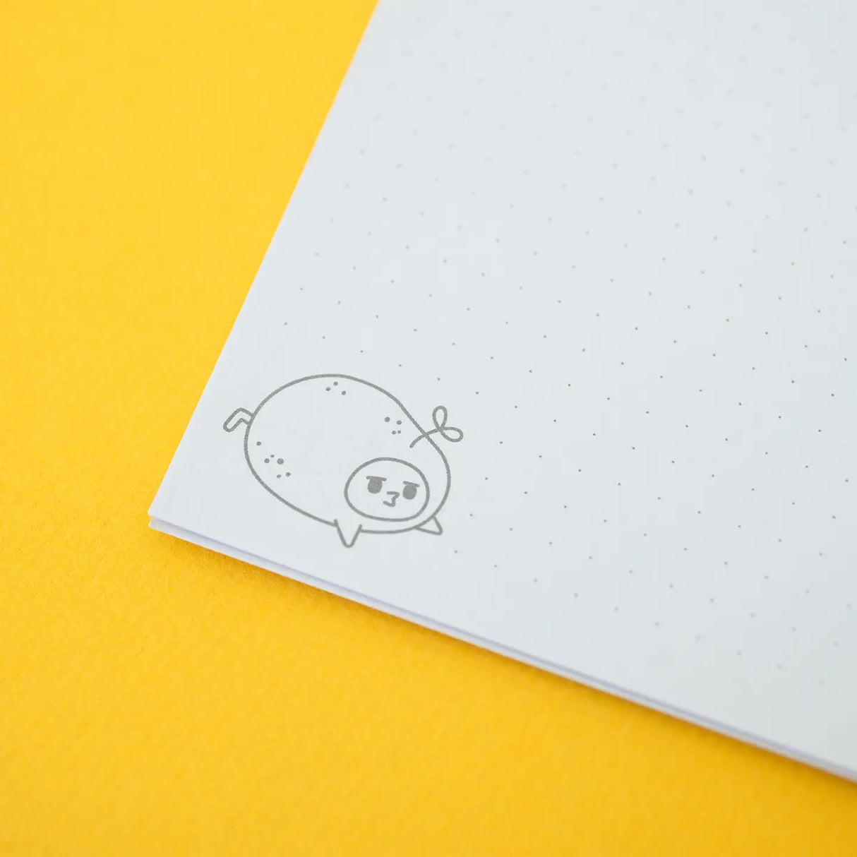 Grumpy Chicken Potato Mode Notebook showing dotted interior pages with cute grumpy chicken potato illustration corner