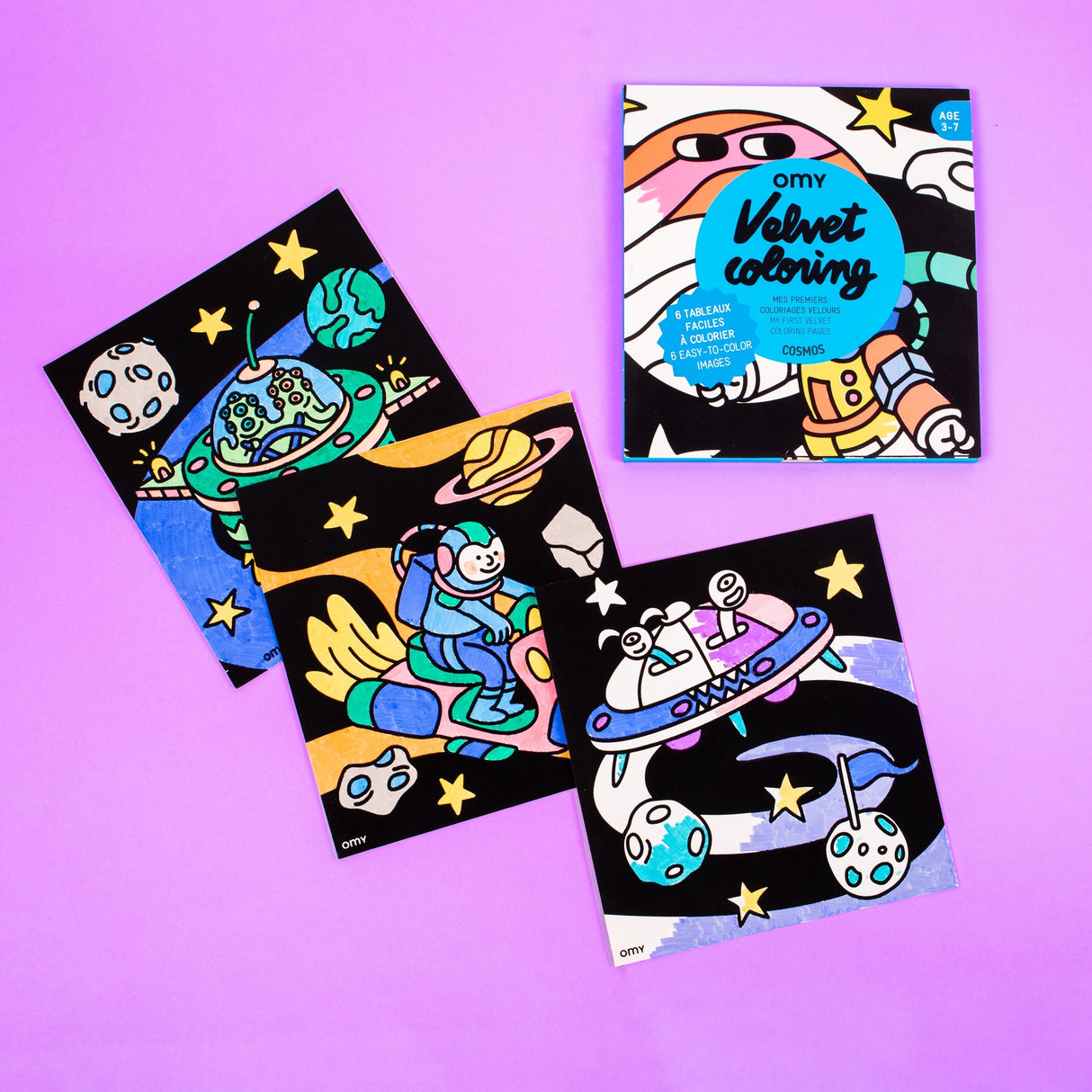 Set of colorful velvet coloring sheets with space-themed illustrations on a purple background for kids ages 3 to 7.