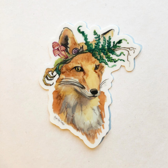 Foraging Fox Sticker showing a watercolor fox with a fern and mushrooms crown, handmade by Gray Day Studio.