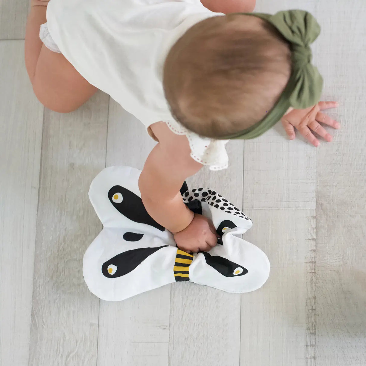 Baby playing with Organic Crinkle Toy | Butterfly made of 100% organic cotton with crinkle paper inside.