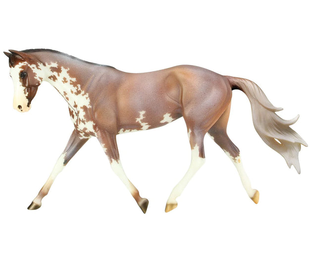 Full Moon Rising model horse in mid-stride, showcasing detailed paint and athletic build, traditional 1:9 scale figure.