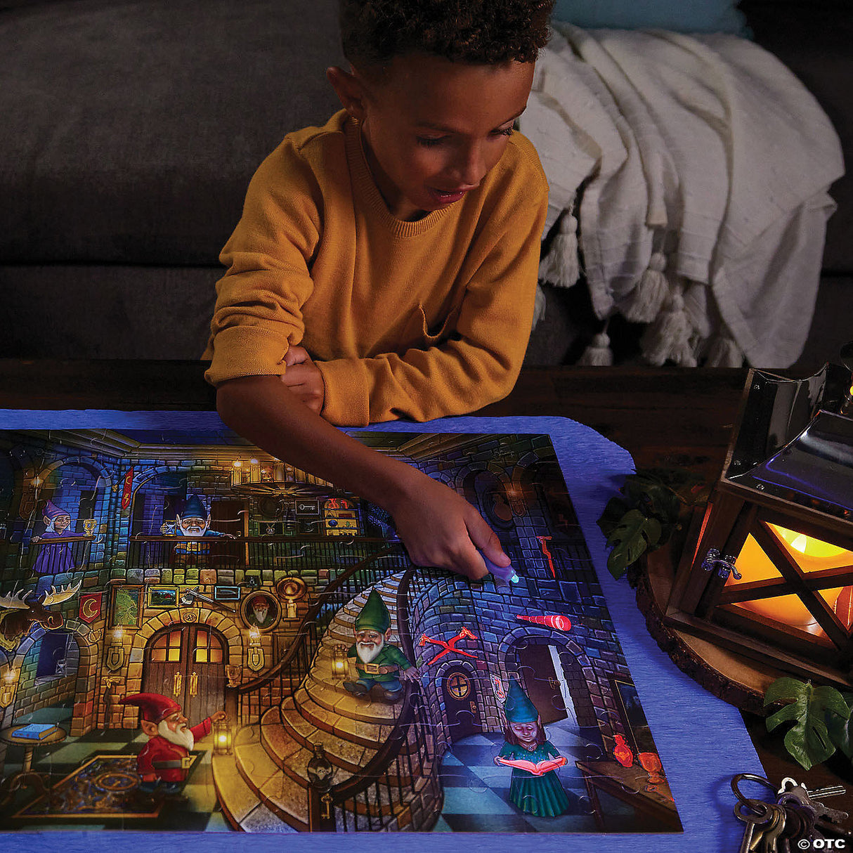 Child exploring glow-in-the-dark hidden items on the PZ 100pc Seek&Find Gnomes puzzle with reveal light.