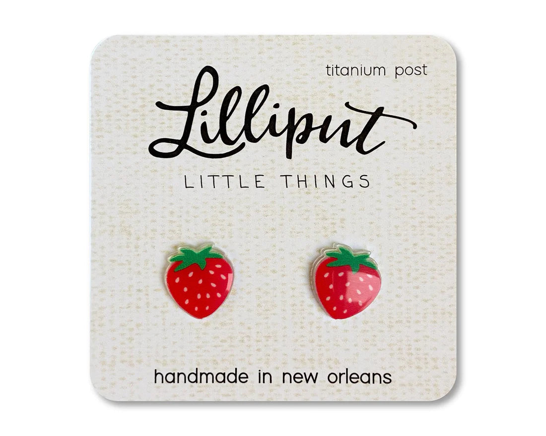 Strawberry Earrings featuring handmade red strawberry studs with titanium posts on a branded card from Lilliput.