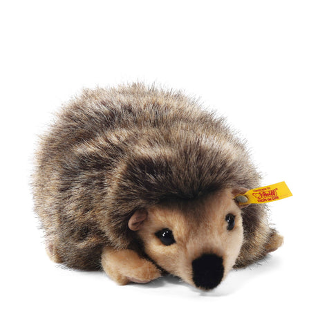 Hedgehog Joggi plush with soft tipped fur, realistic colors, and Steiff's signature yellow "Button in Ear" tag.