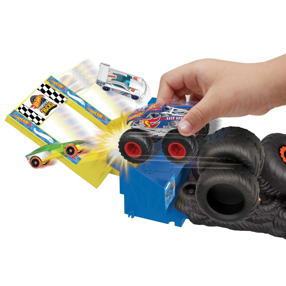 Hand launching Hot Wheels Monster Trucks Arena Smashers Race Ace Smash Race Challenge with tire obstacles and colorful cars.