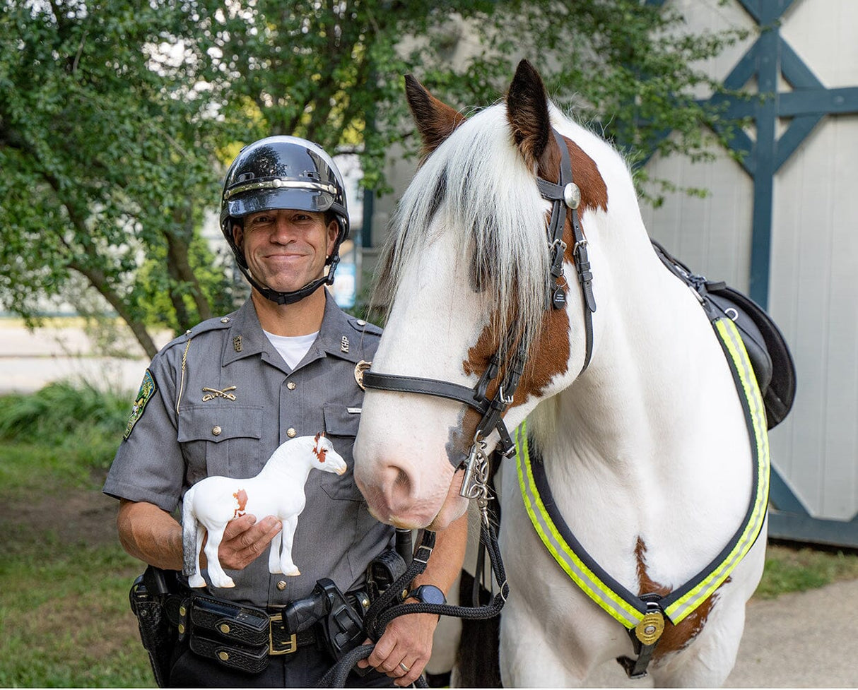 Hytyme Legend Kentucky Horse Park Police Horse with officer holding a matching miniature model figure.