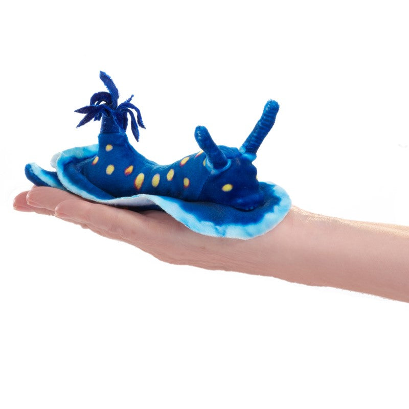 Blue Nudibranch Finger Puppet resting on a hand, soft plush toy with bright blue and yellow colors for sensory play.