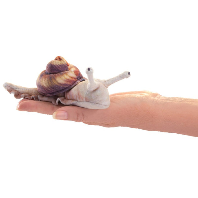 Snail Finger Puppet resting on a hand, showing detailed lifelike design with weighted beads for nature play and storytelling.