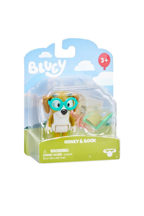 Bluey Story Starter Figure Pack Series 9 featuring Honey with teal glasses and a book accessory in packaging.