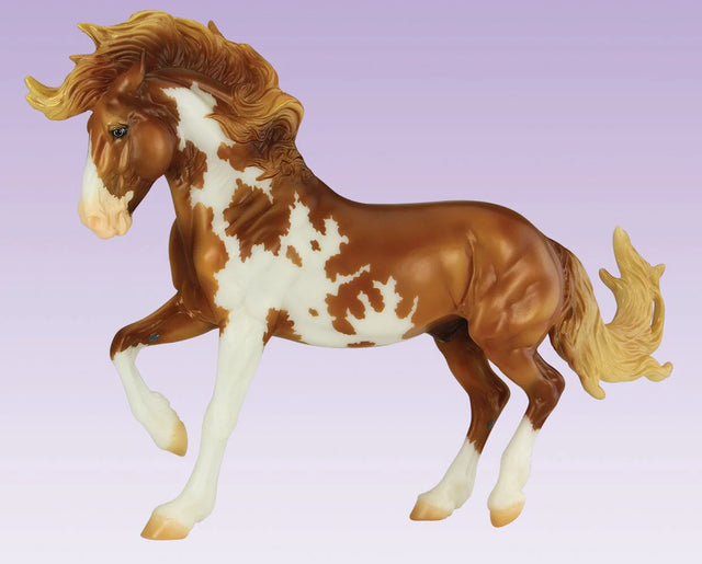 Mojave Mustang model horse with flowing mane, rich overo pinto coat, poised stance, and detailed sculpting against a purple background.
