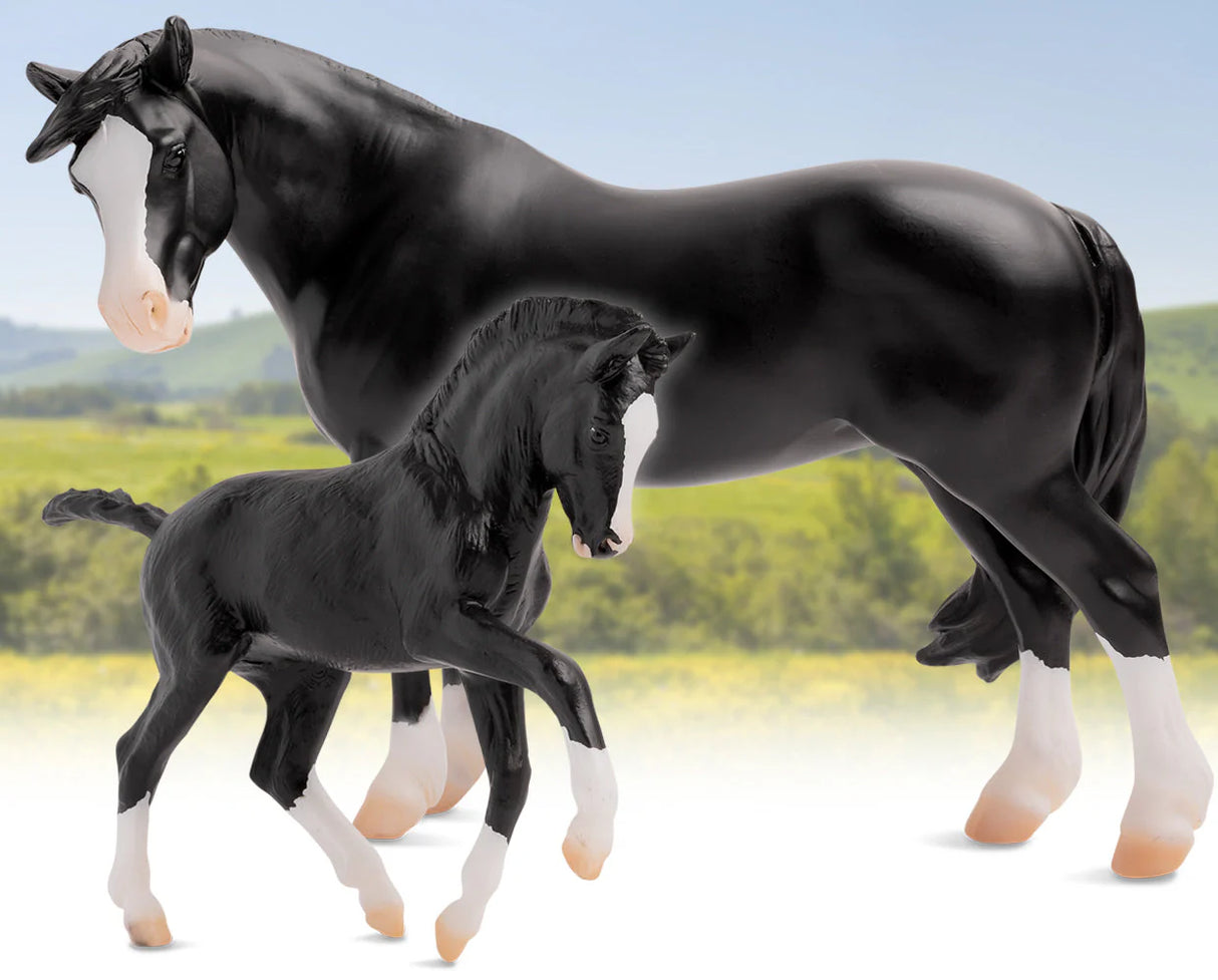 Nistar Blazing Kansas LOM & GTF Blazing Ethel model horses standing together in a natural outdoor setting.