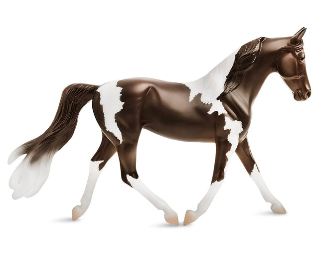 Pinto model horse with brown and white patches, detailed mane and tail, Freedom Series 1:12 scale collectible.
